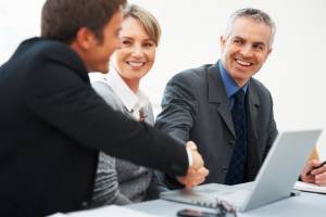 Business man shaking hands with colleague